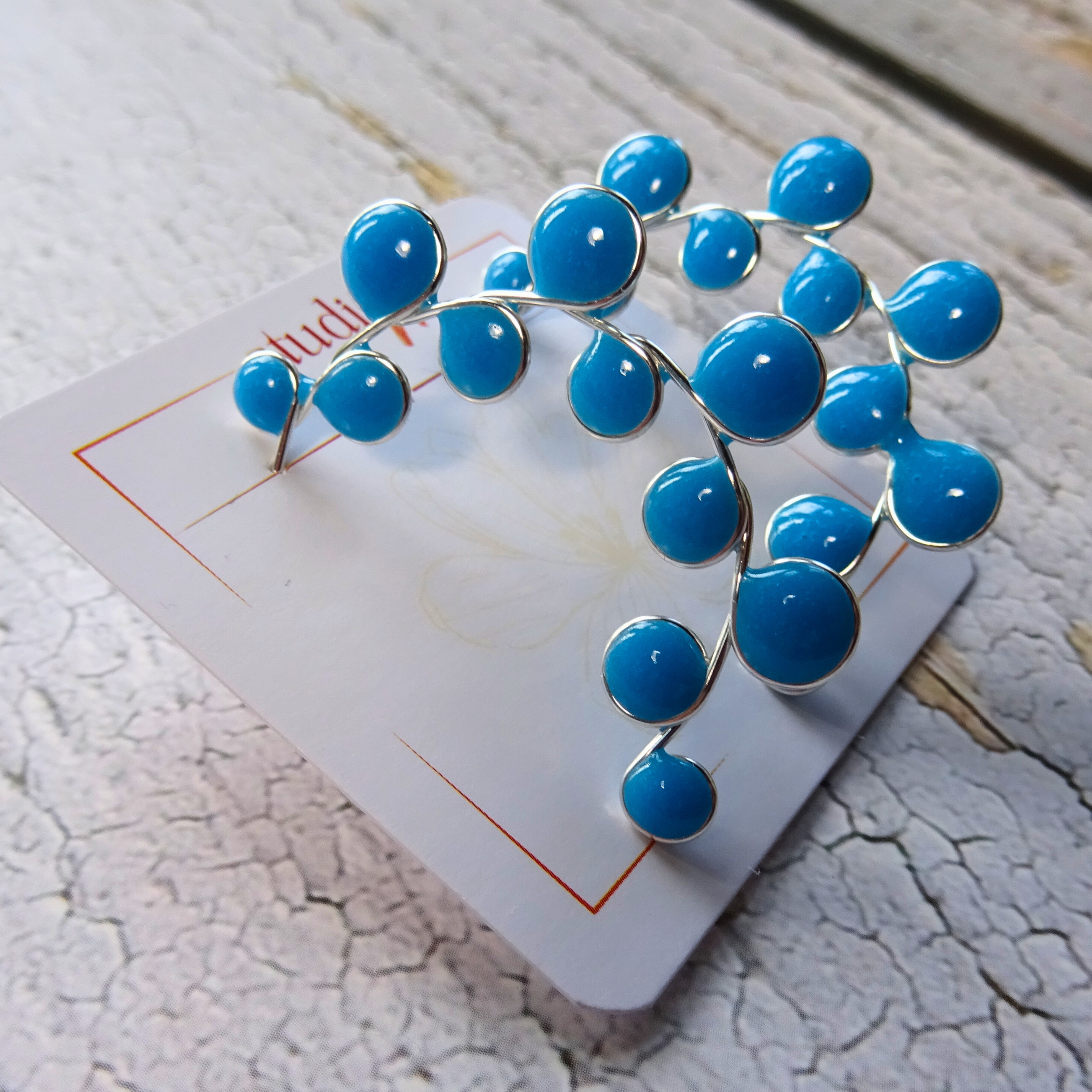 Blue glow in the dark hoop earrings