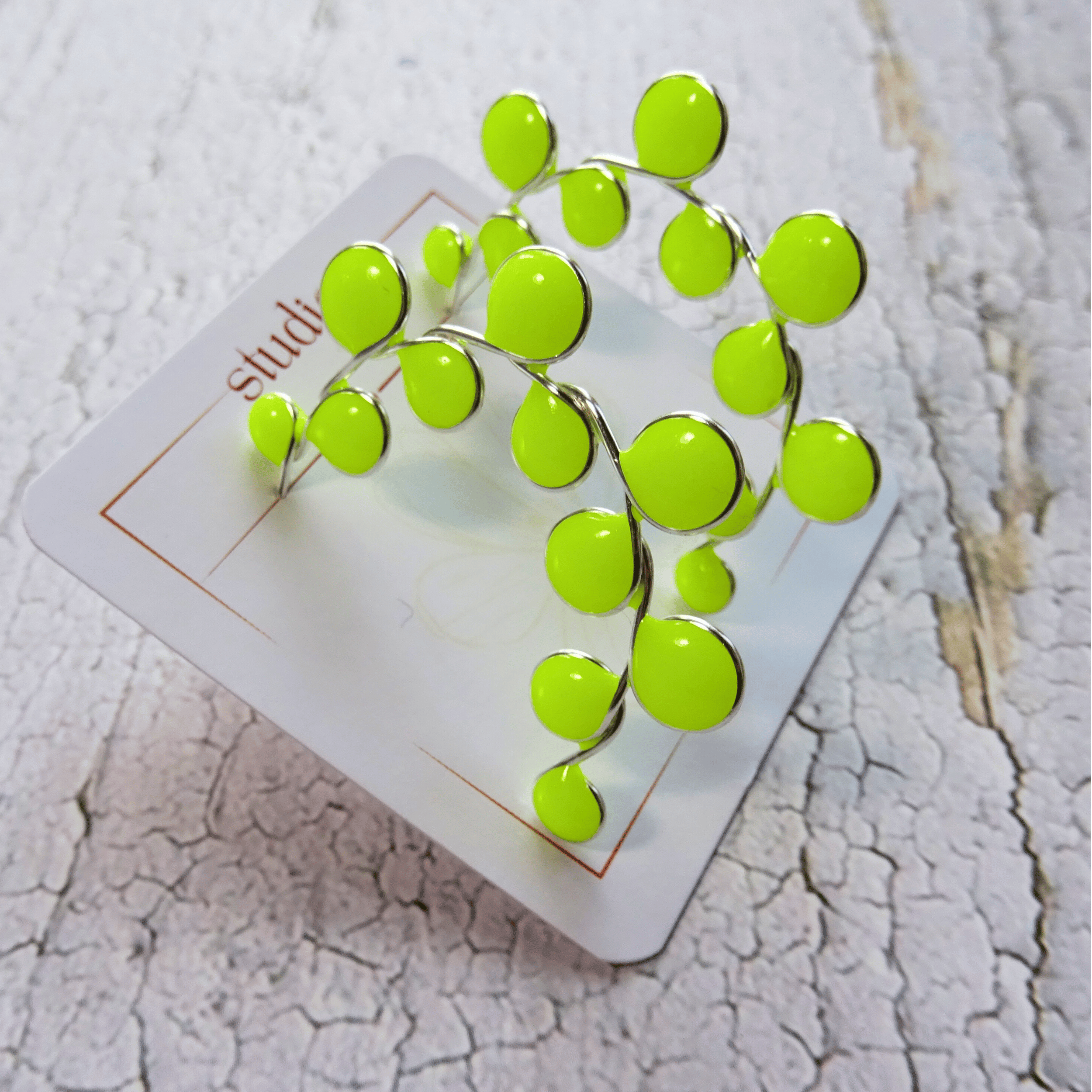 Neon yellow glow in the dark hoop earrings
