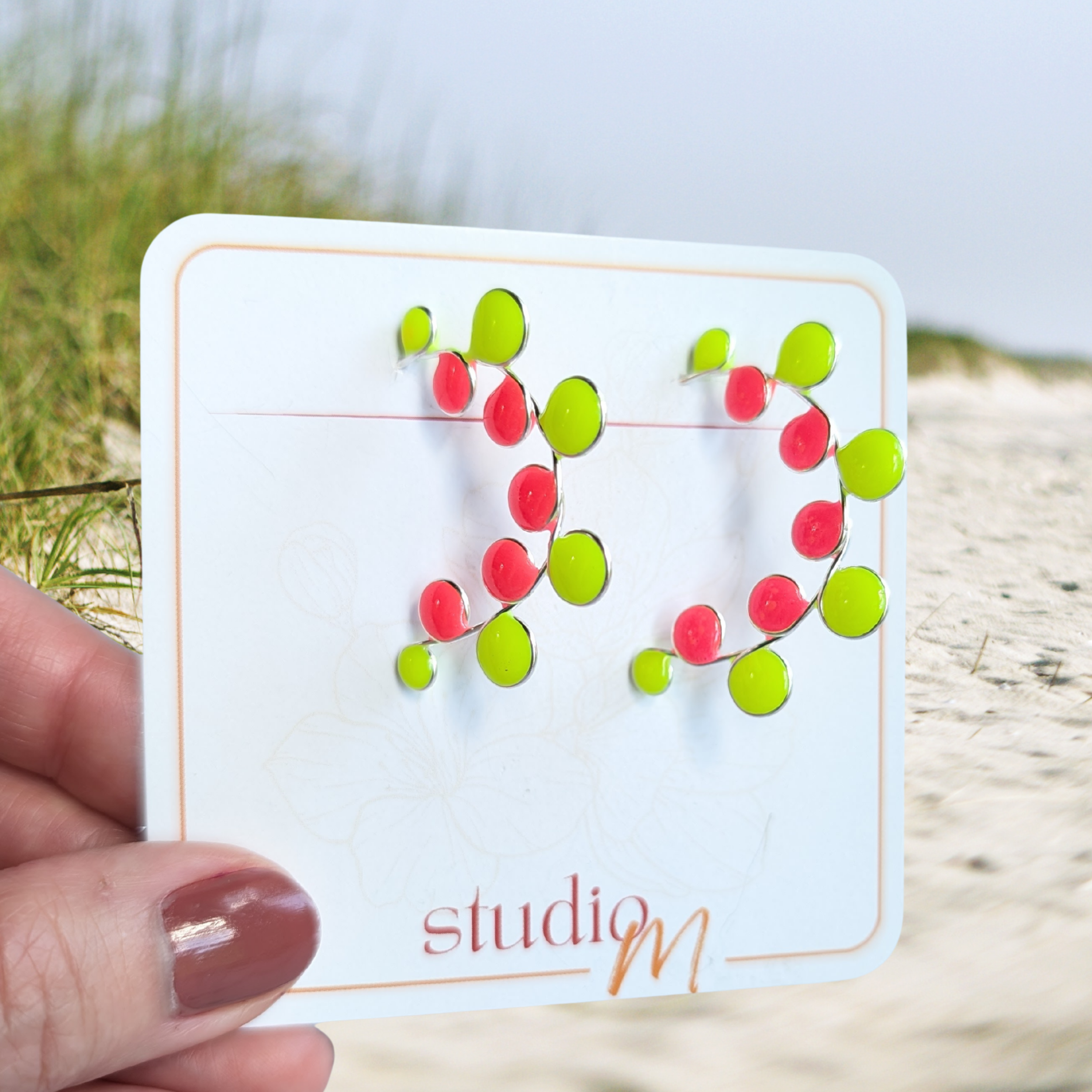 Neon colored pink and yellow glow in the dark hoop earrings
