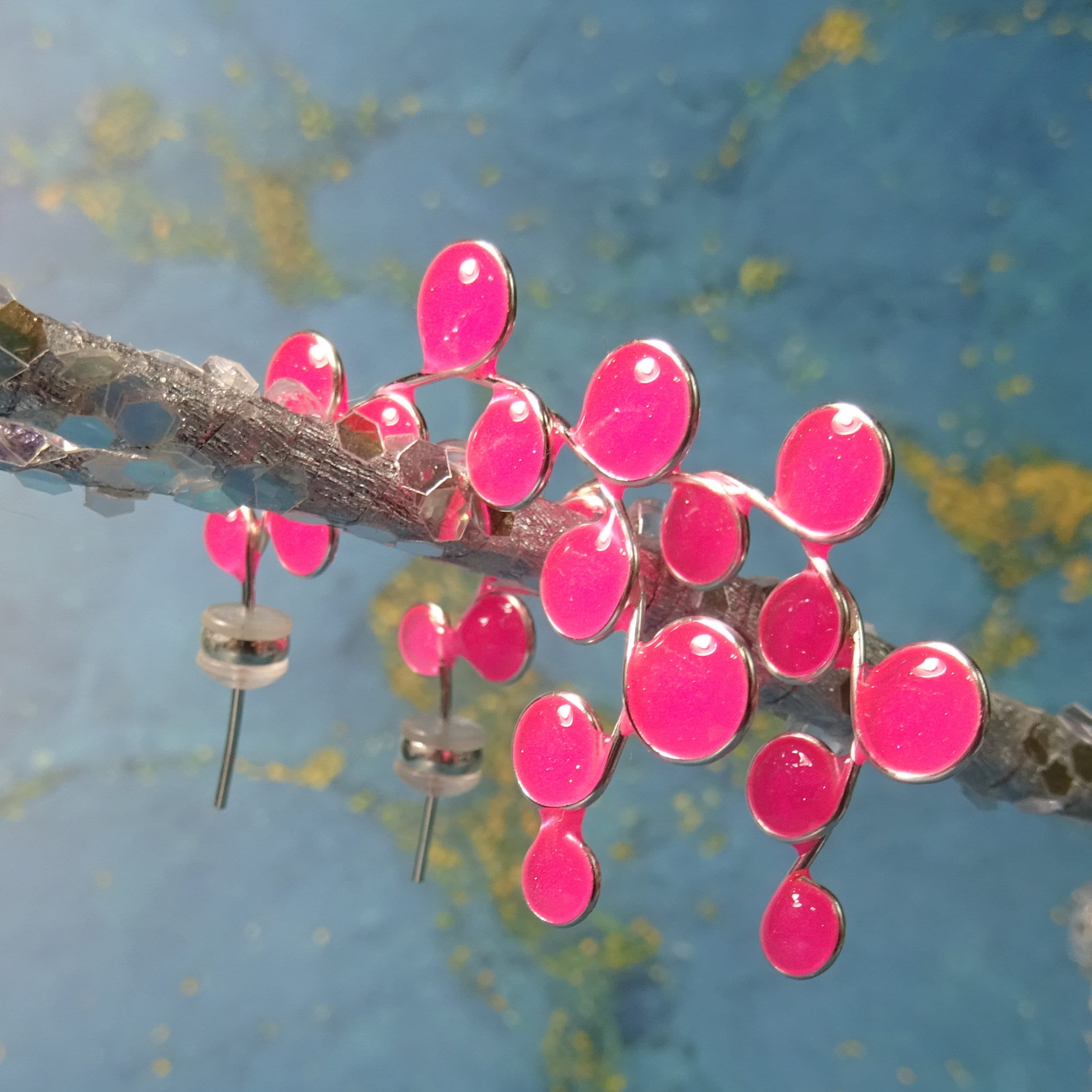 Neon pink glow in the dark hoop earrings