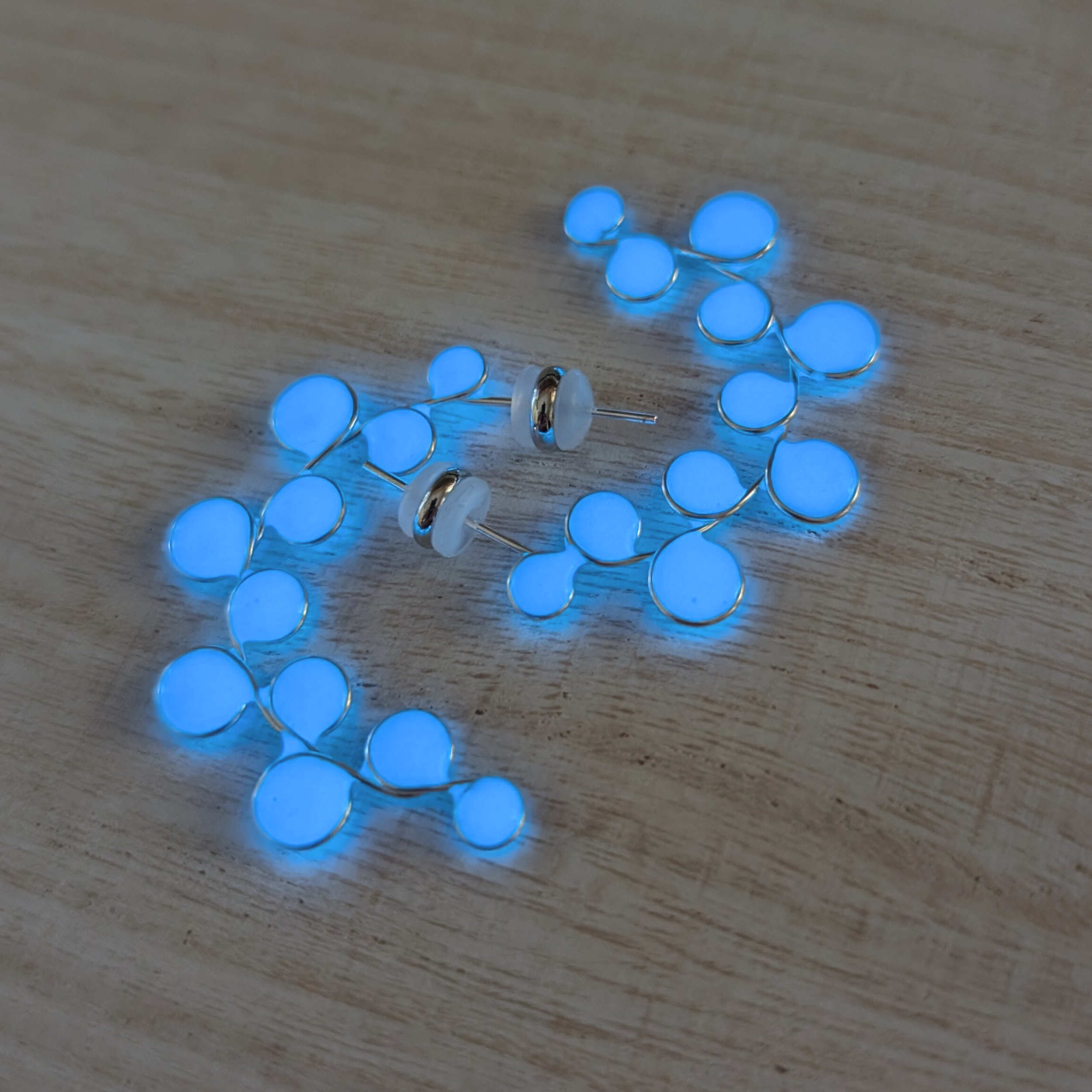 Blue glow in the dark hoop earrings