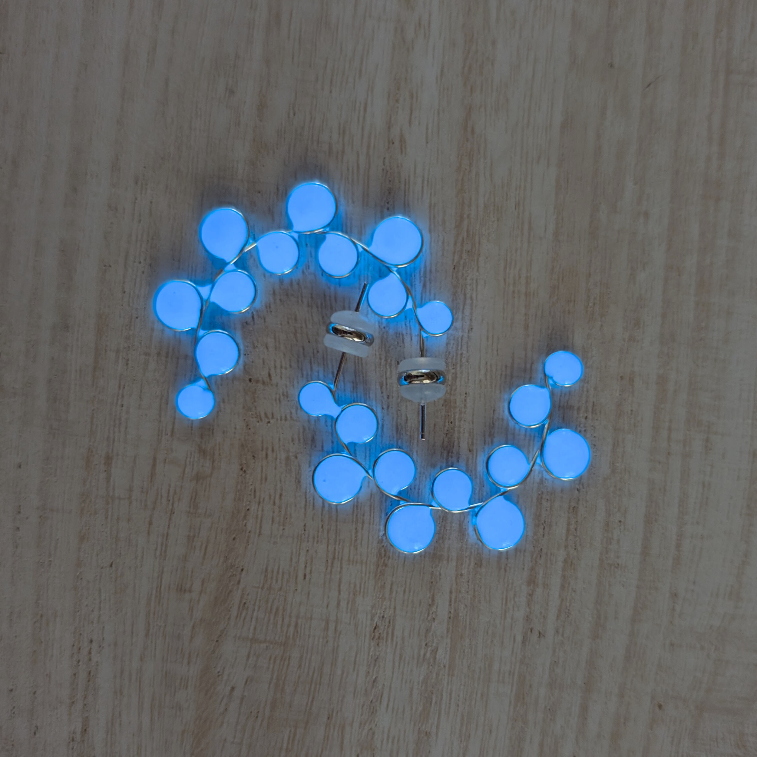 Blue glow in the dark hoop earrings