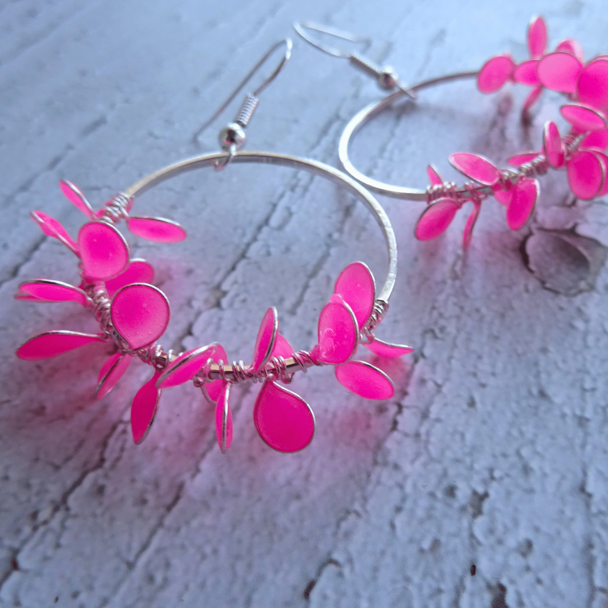 pink hoop earrings with flower petals
