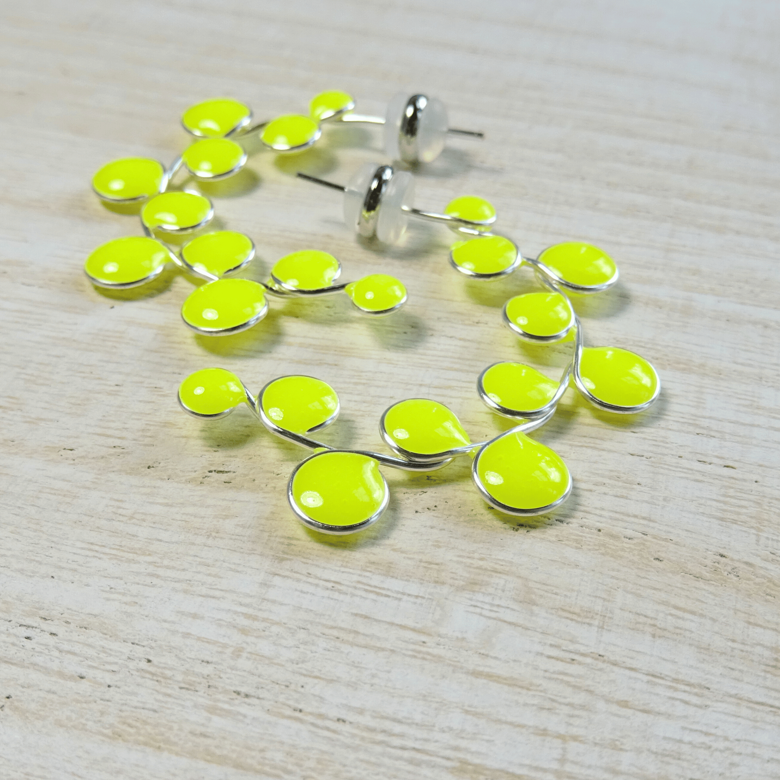 Neon yellow glow in the dark hoop earrings
