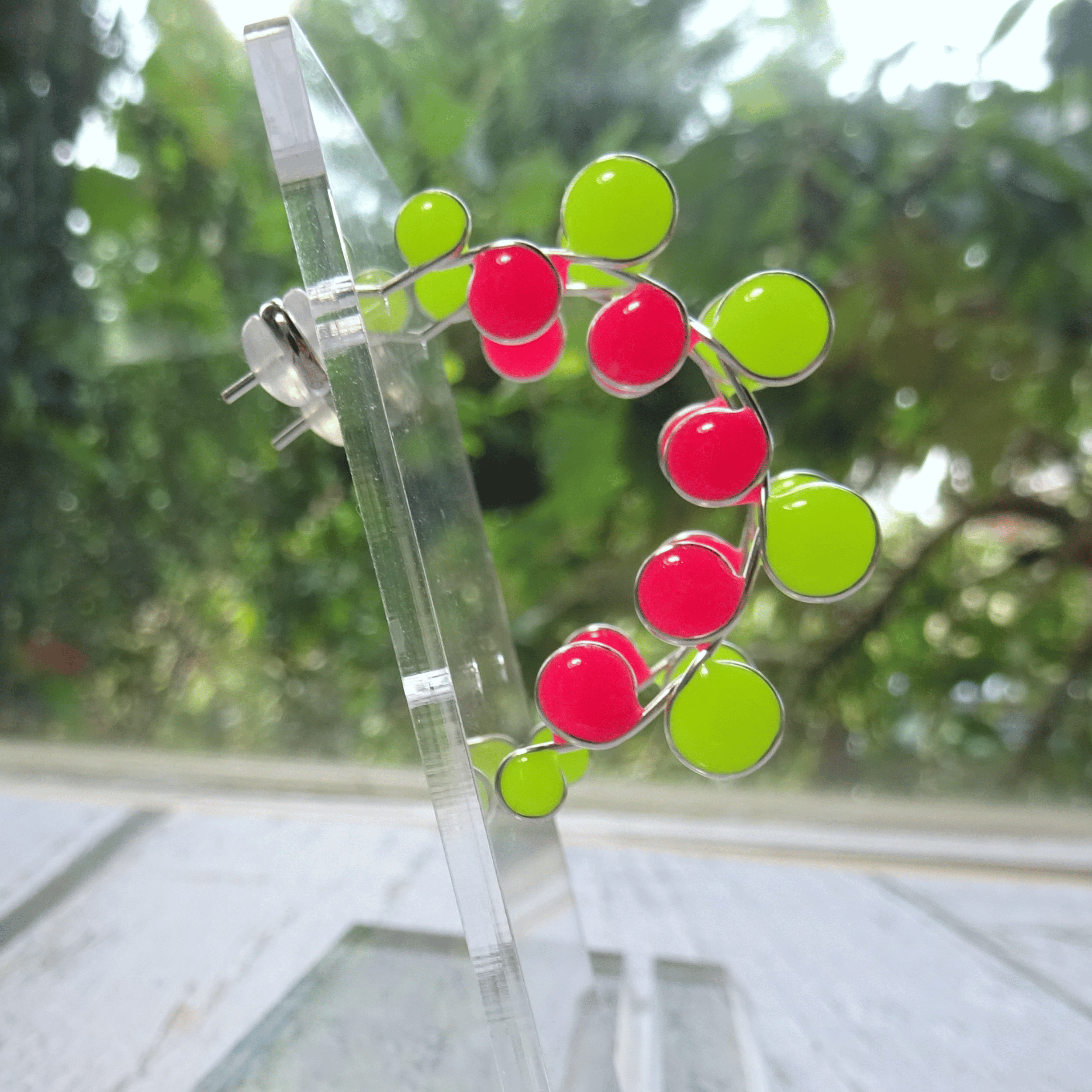 Neon colored pink and yellow glow in the dark hoop earrings