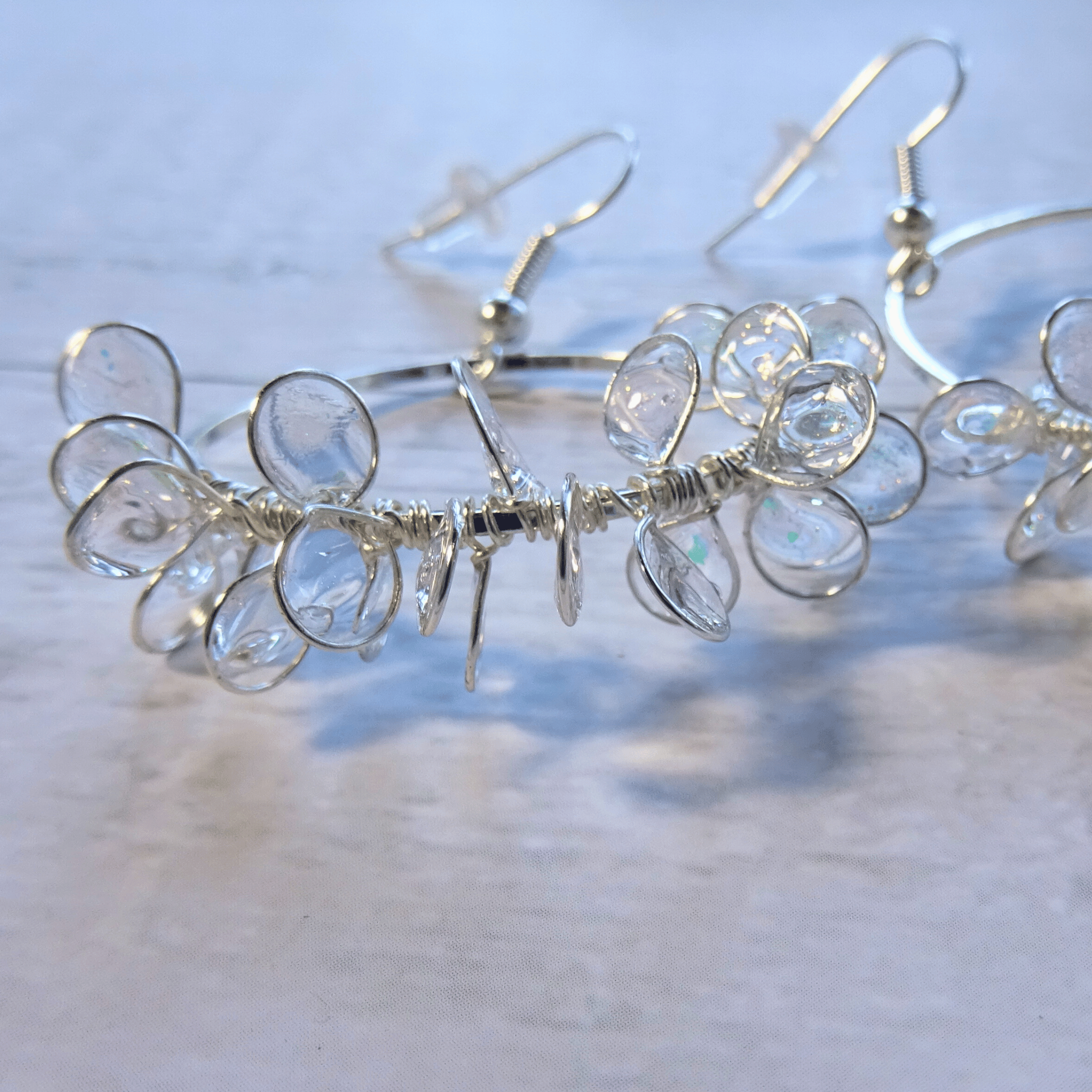 Clear ice flower hoop earrings