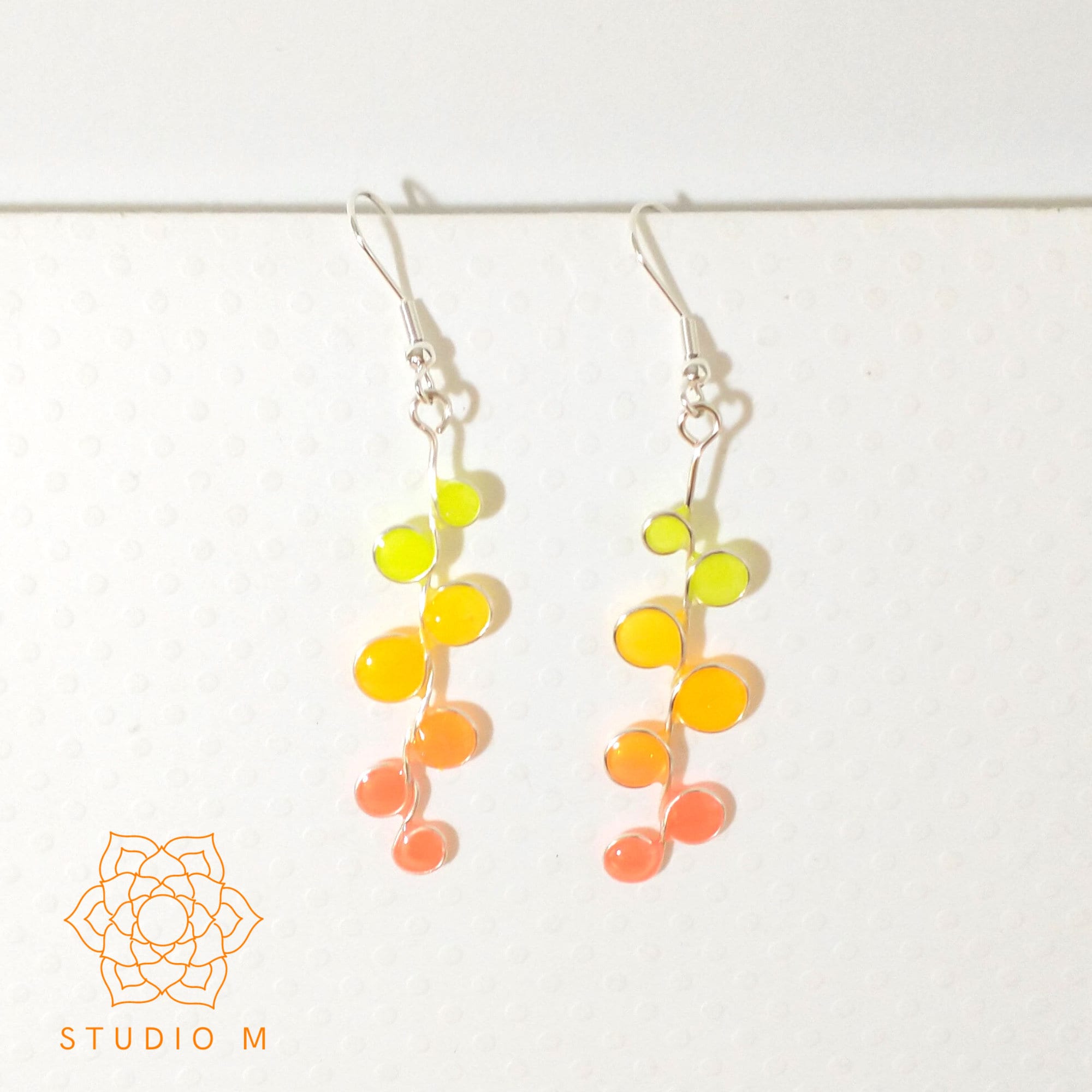 Peachy neon glow in the dark earrings