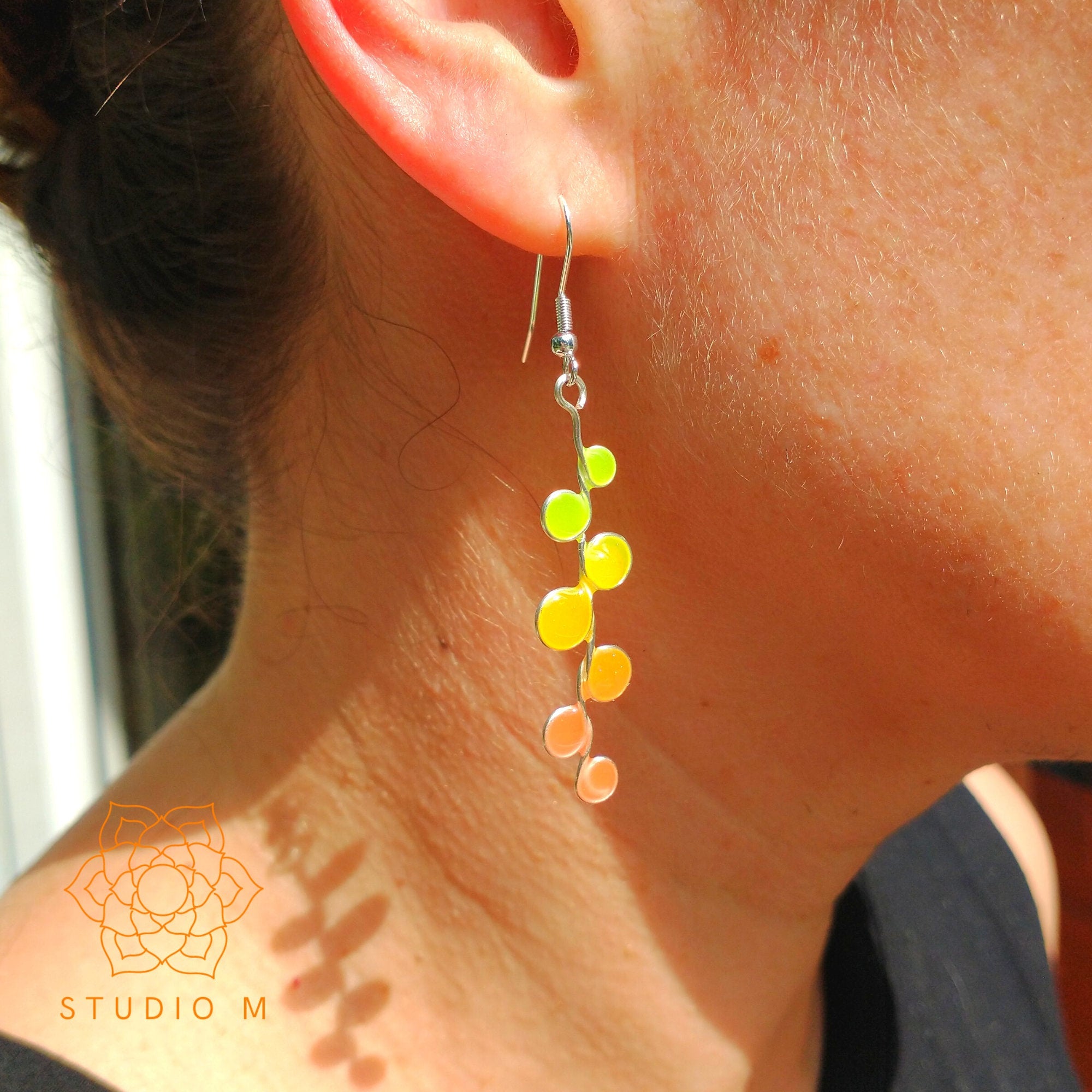 Peachy neon glow in the dark earrings