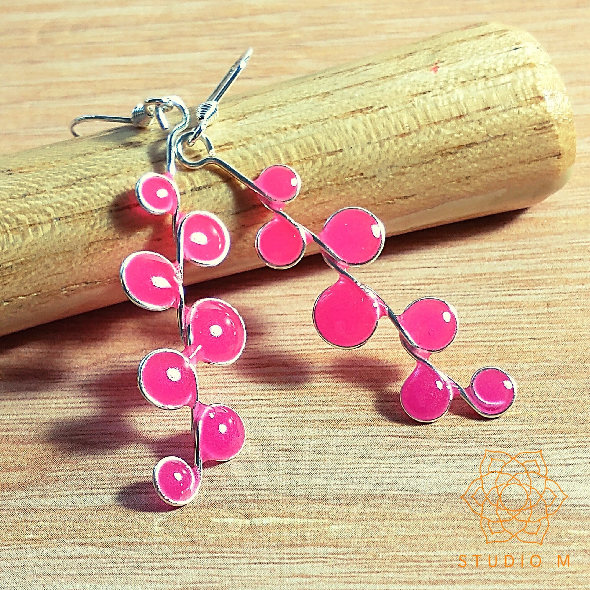 Neon pink glow in the dark earrings