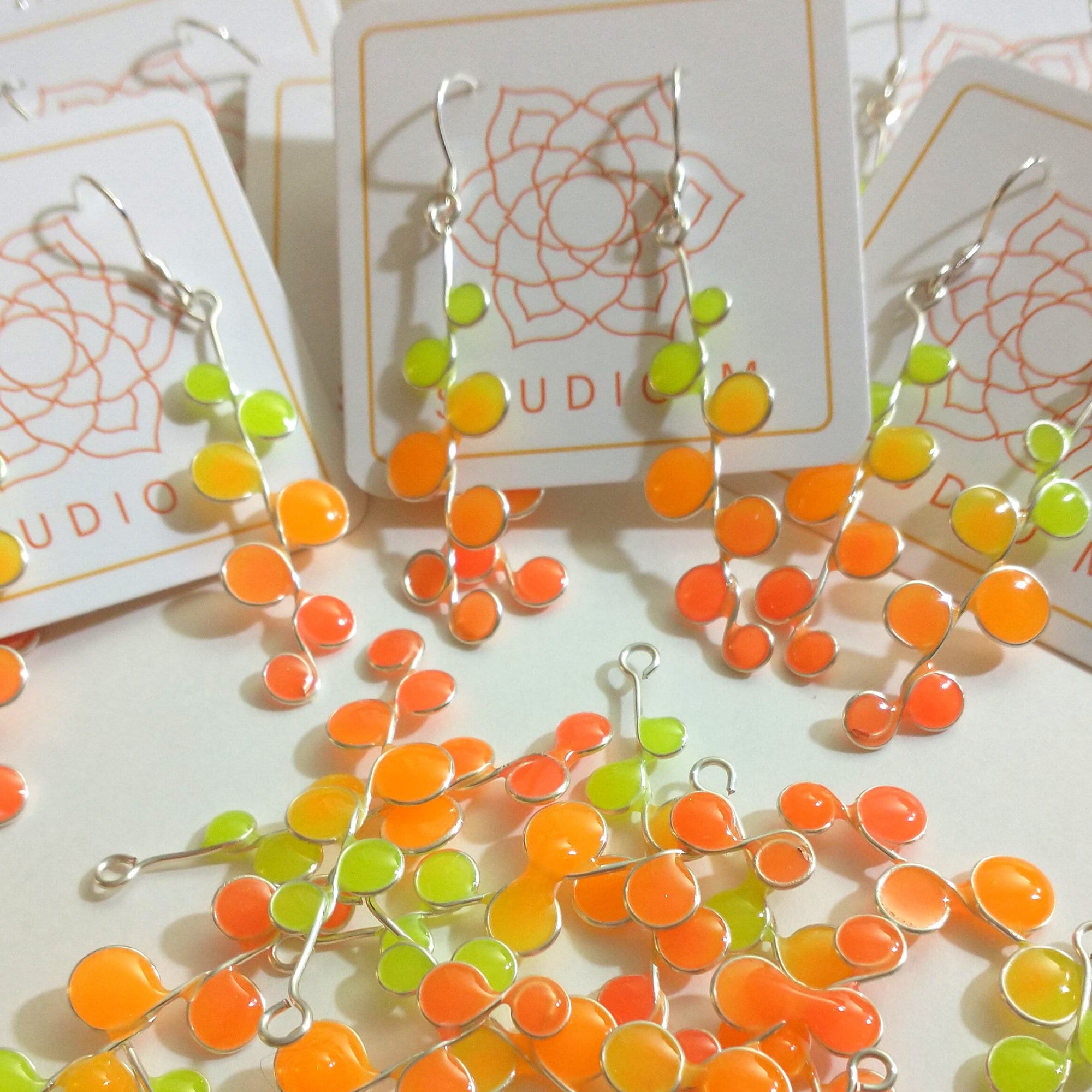 Peachy neon glow in the dark earrings