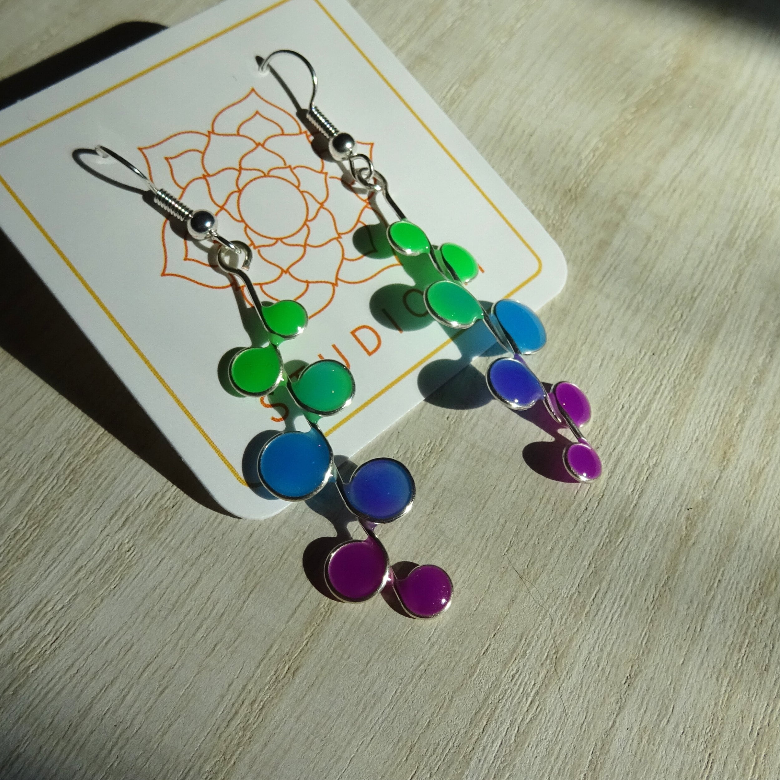 Green, blue, and purple Glow in the Dark Earrings