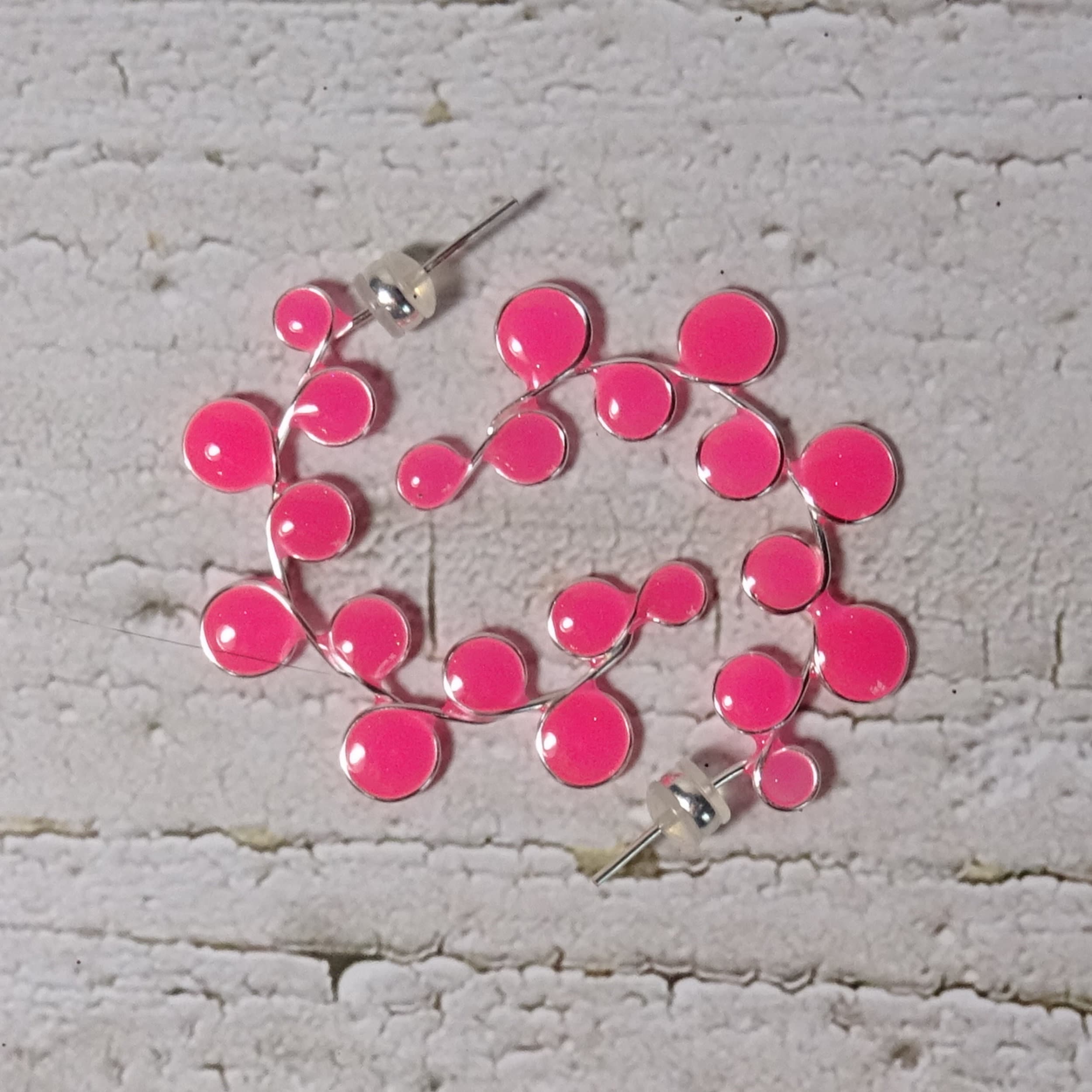 Neon pink glow in the dark hoop earrings