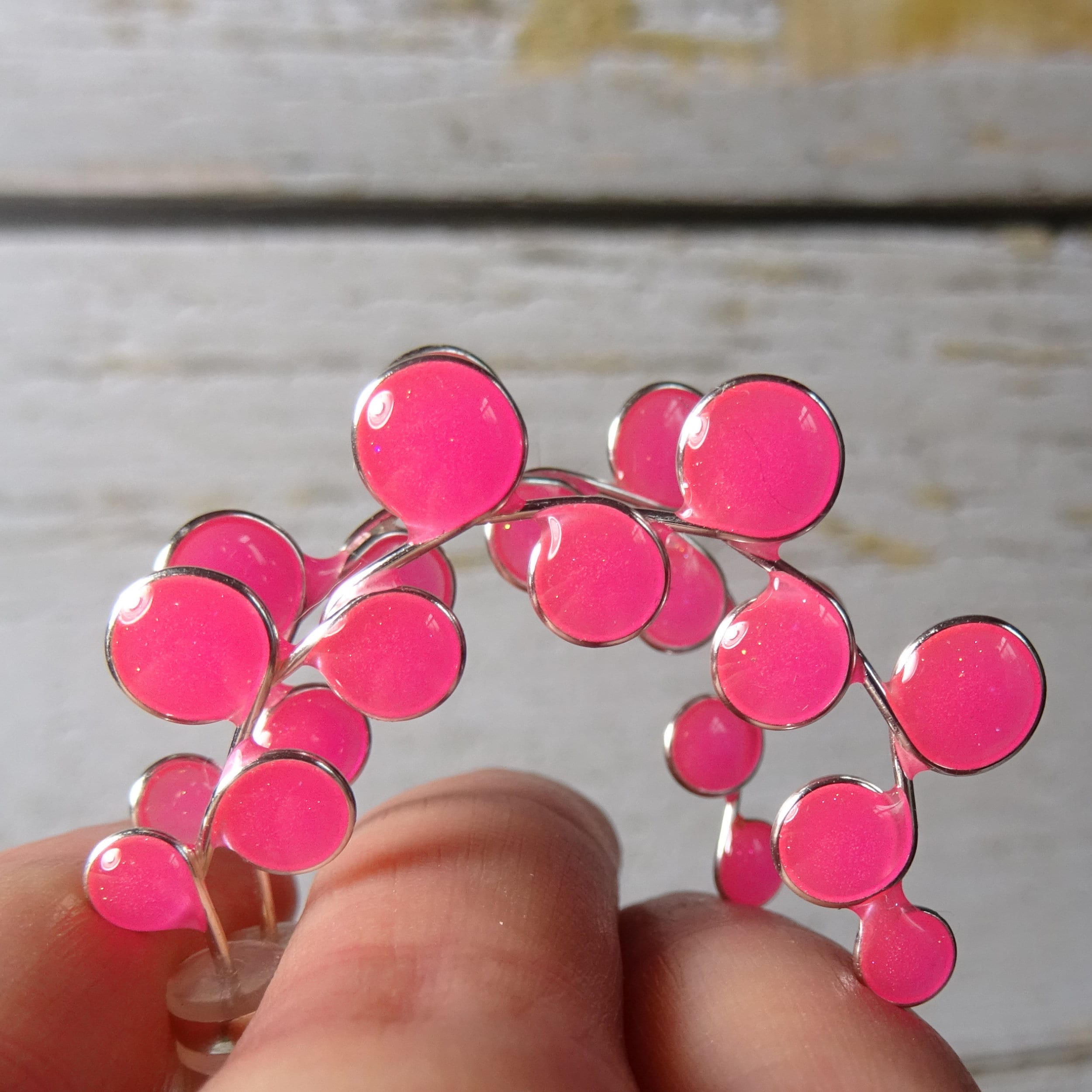 Neon pink glow in the dark hoop earrings